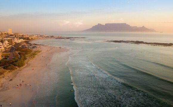 Table mountain in the mist with beautiful beach in front